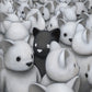 A stylized illustration of many small white bears, surrounding a single black bear.  