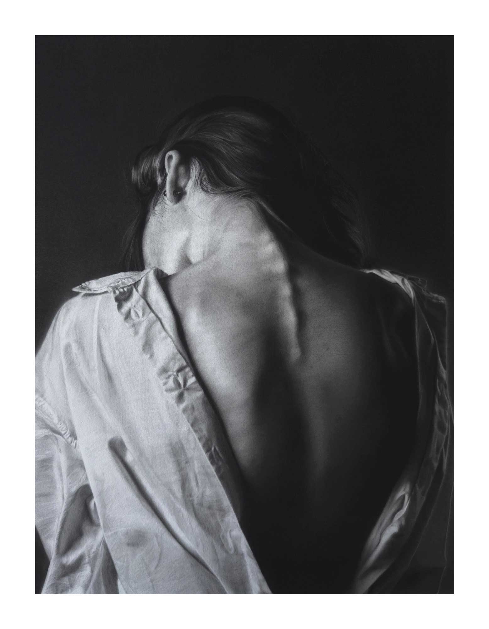 Print of a charcoal and graphite drawing of a woman's bare back and neck, wearing an open shirt, set against a dark background.